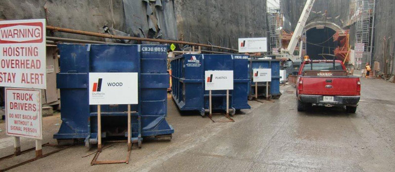 Niagara Tunnel recycling project with labeled dump bins.